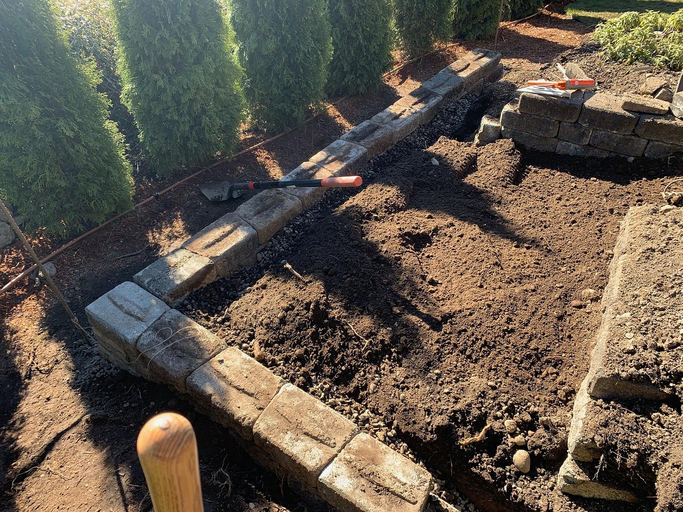 Getting the retaining wall in place.