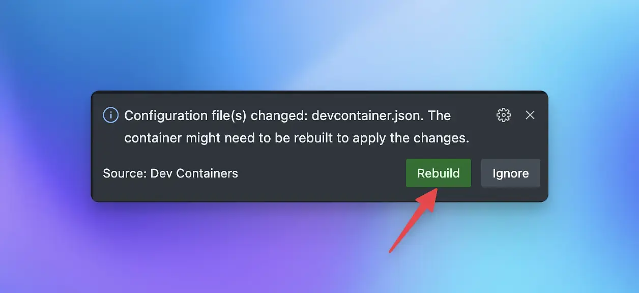 A screenshot of VS Code showing you where to click to rebuild the dev container.