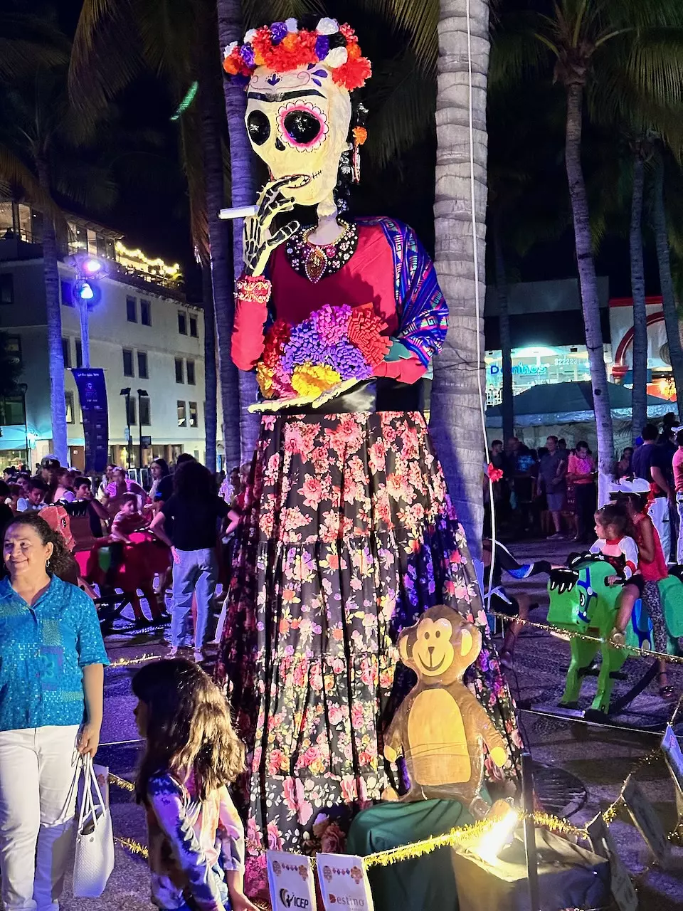A purple and pink Catrina doll